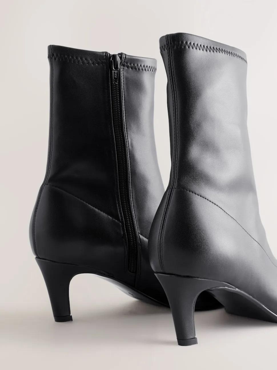 Black Forever Comfort® Pointed Toe Sock Boots