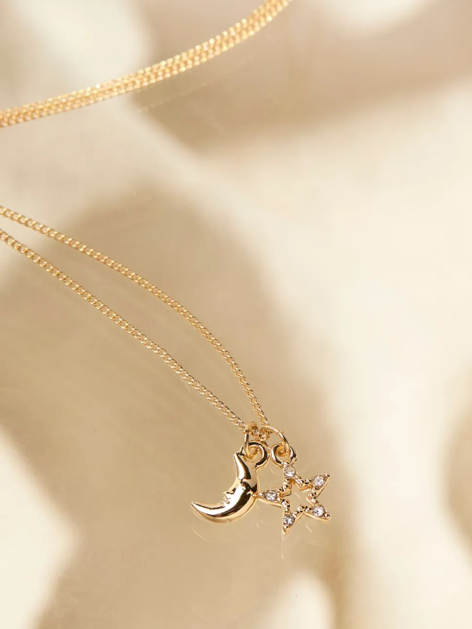 FatFace Gold Tone Star and Moon Necklace