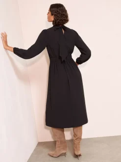 Friends Like These Black High Neck Long Sleeve Midi Dress with Bow Detailing