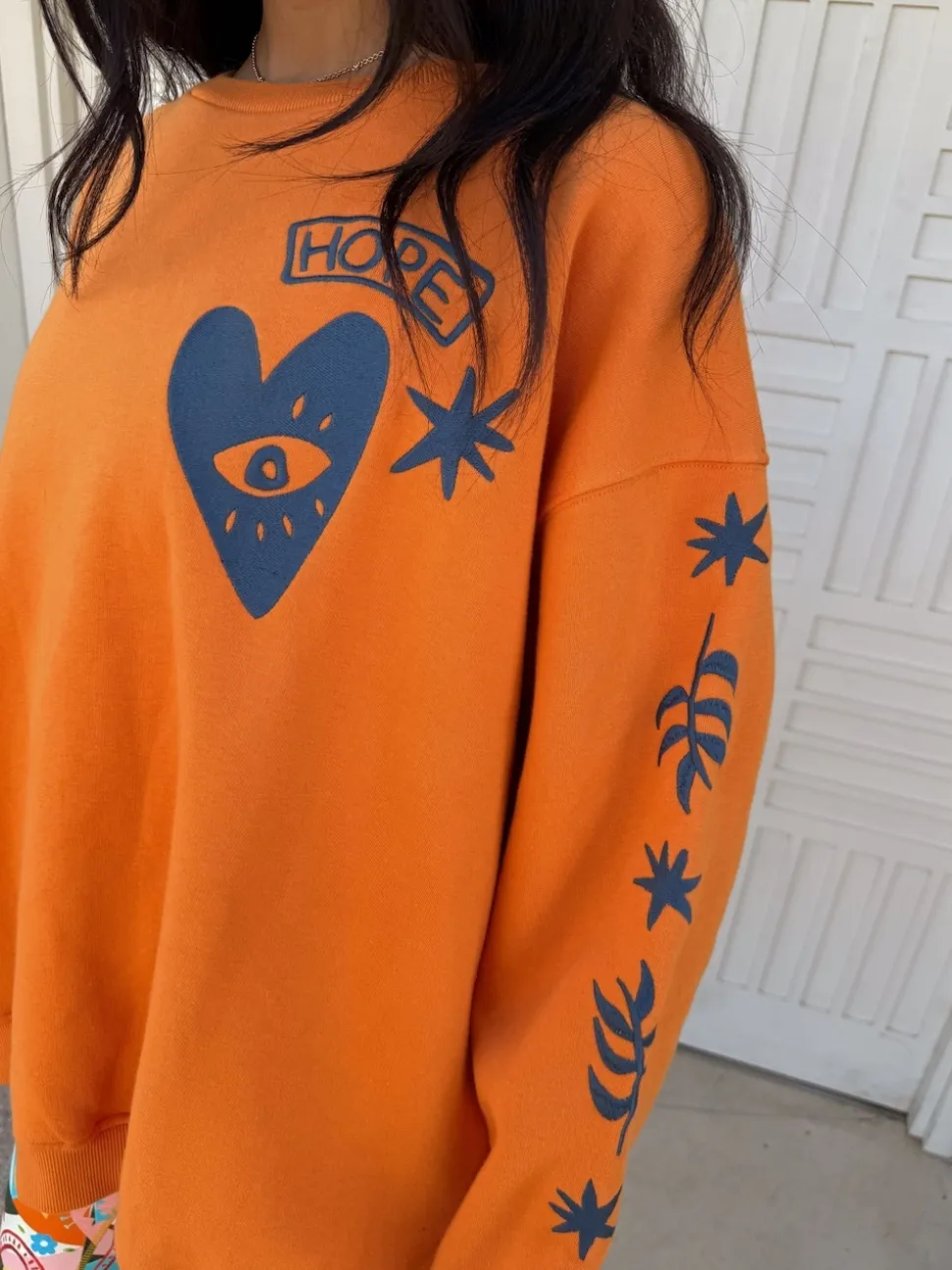 Never Fully Dressed Orange Embroidered Sweatshirt