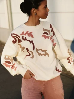 White Sweatshirt with Appliqué Details