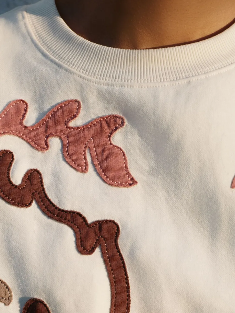 White Sweatshirt with Appliqué Details