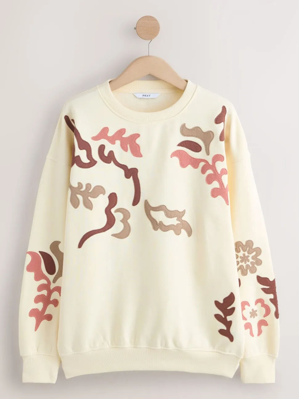 White Sweatshirt with Appliqué Details