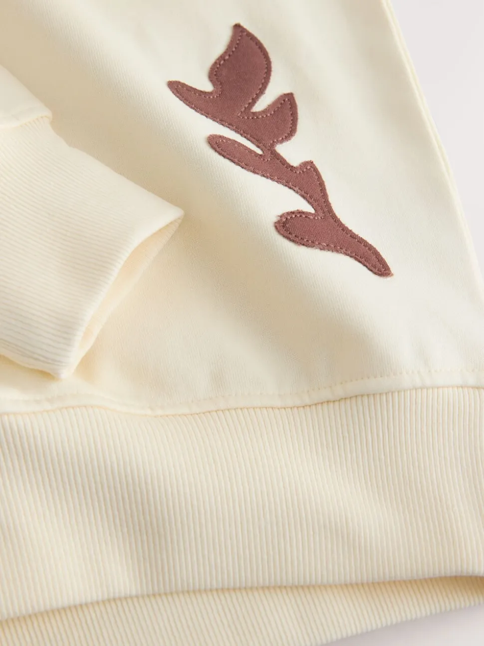 White Sweatshirt with Appliqué Details